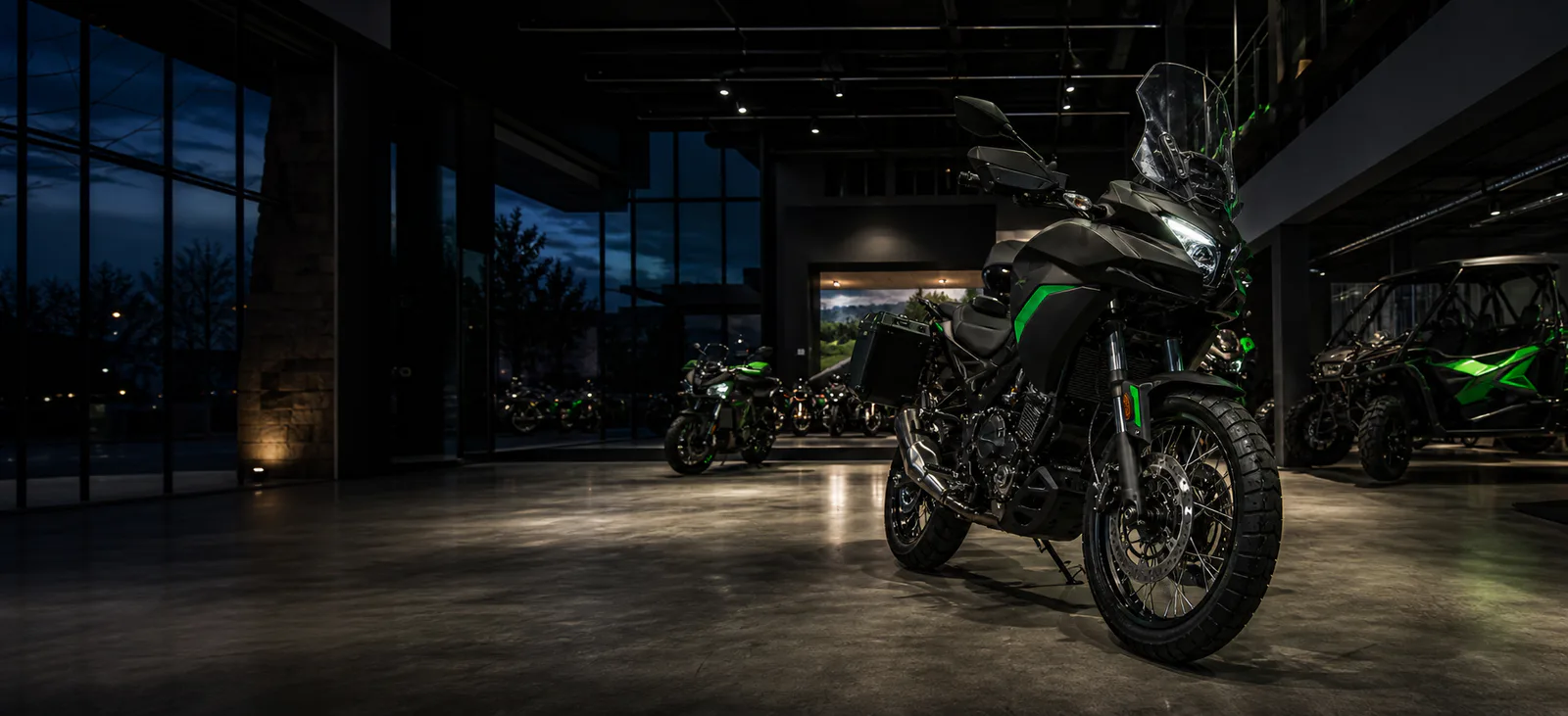 Premium powersports dealership showroom at dusk